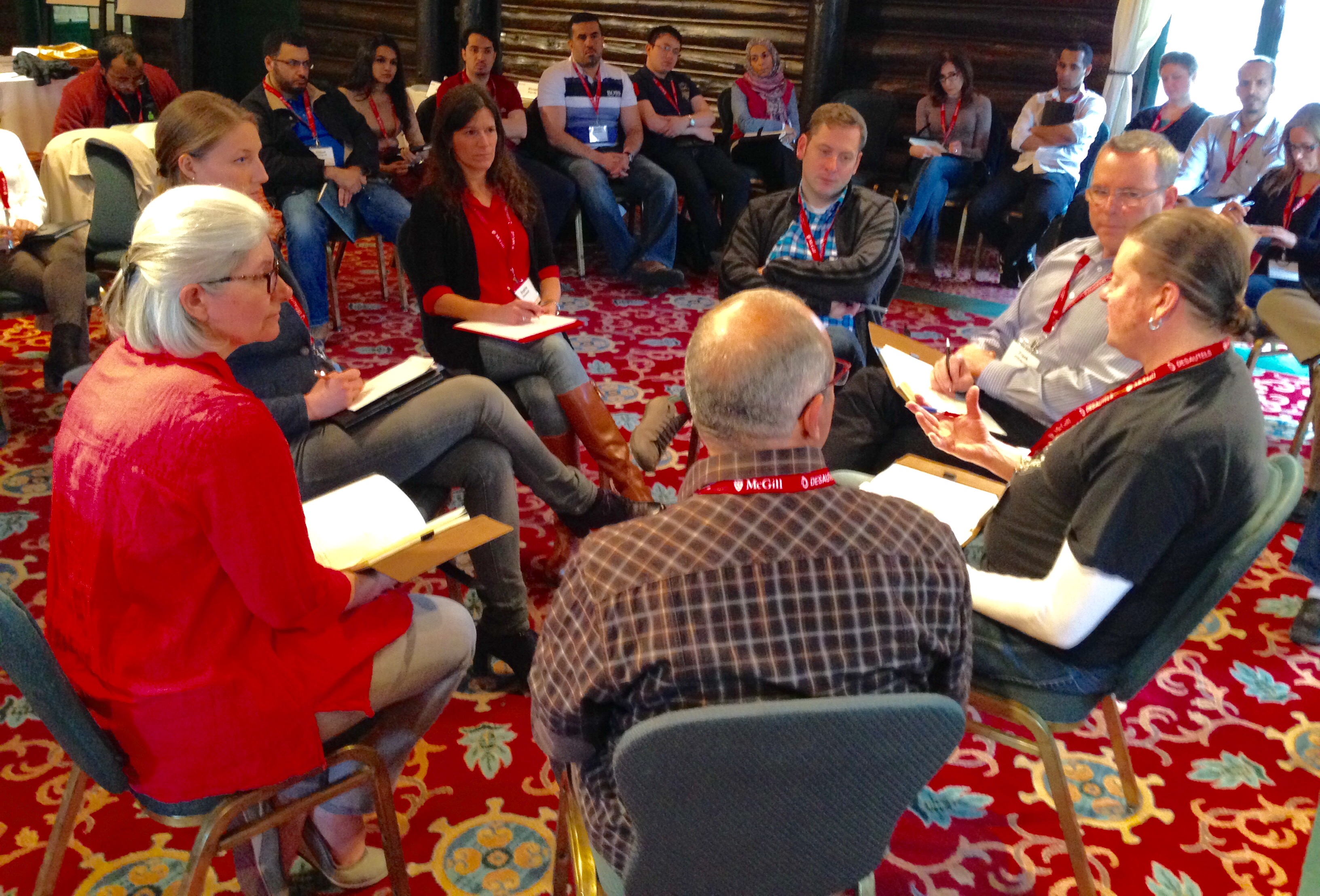 In the plenary, listeners sat in the middle of the big circle, to become talkers—about what they heard.